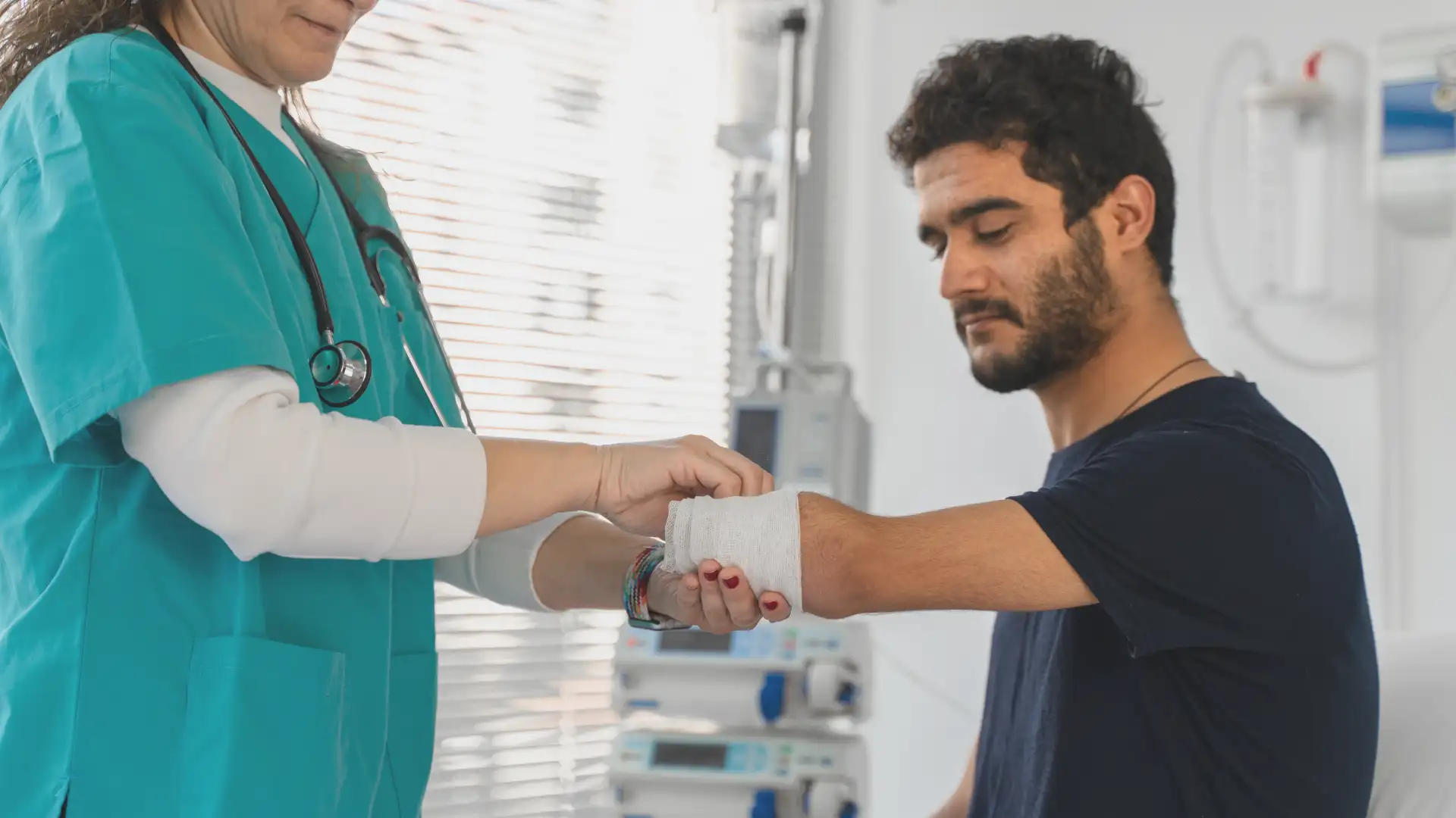 nurse bandaging an amputated arm - loss of limb