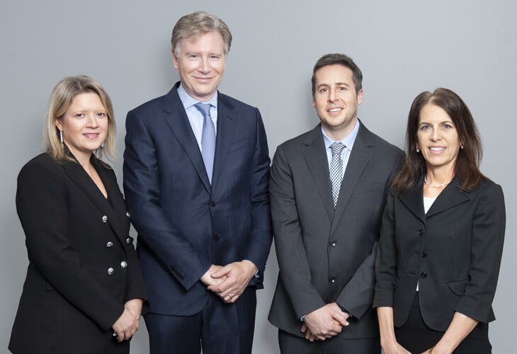 Group shot of the partners of Harris, Keenan & Goldfarb in NYC.